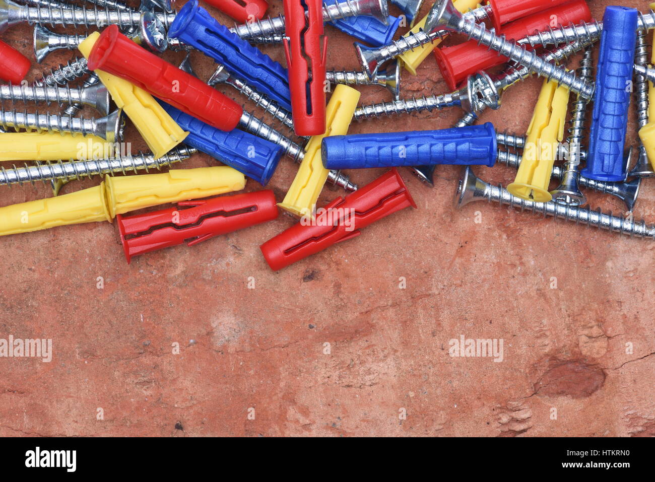 Plastic Dowels ans Screws on Red Brick Background Stock Photo Alamy