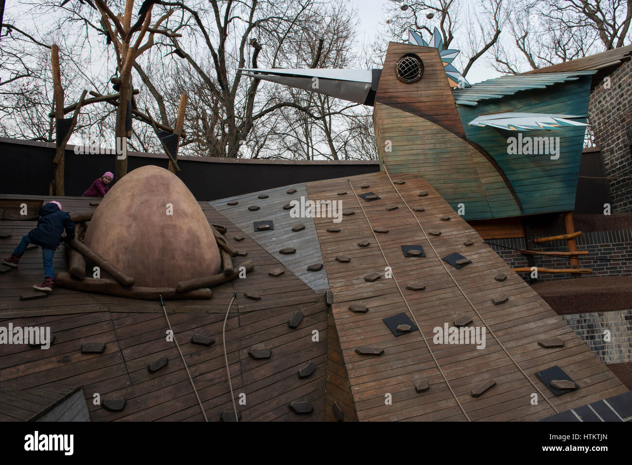 Children climbing on a wooden outdoor playground in the Leipzig Zoological Garden, Leipzig, Saxony, Germany. Stock Photo