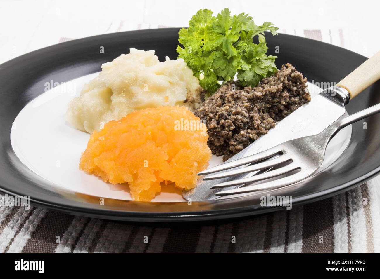 typical scottish meal on burns night, haggis, swede and mashed potato