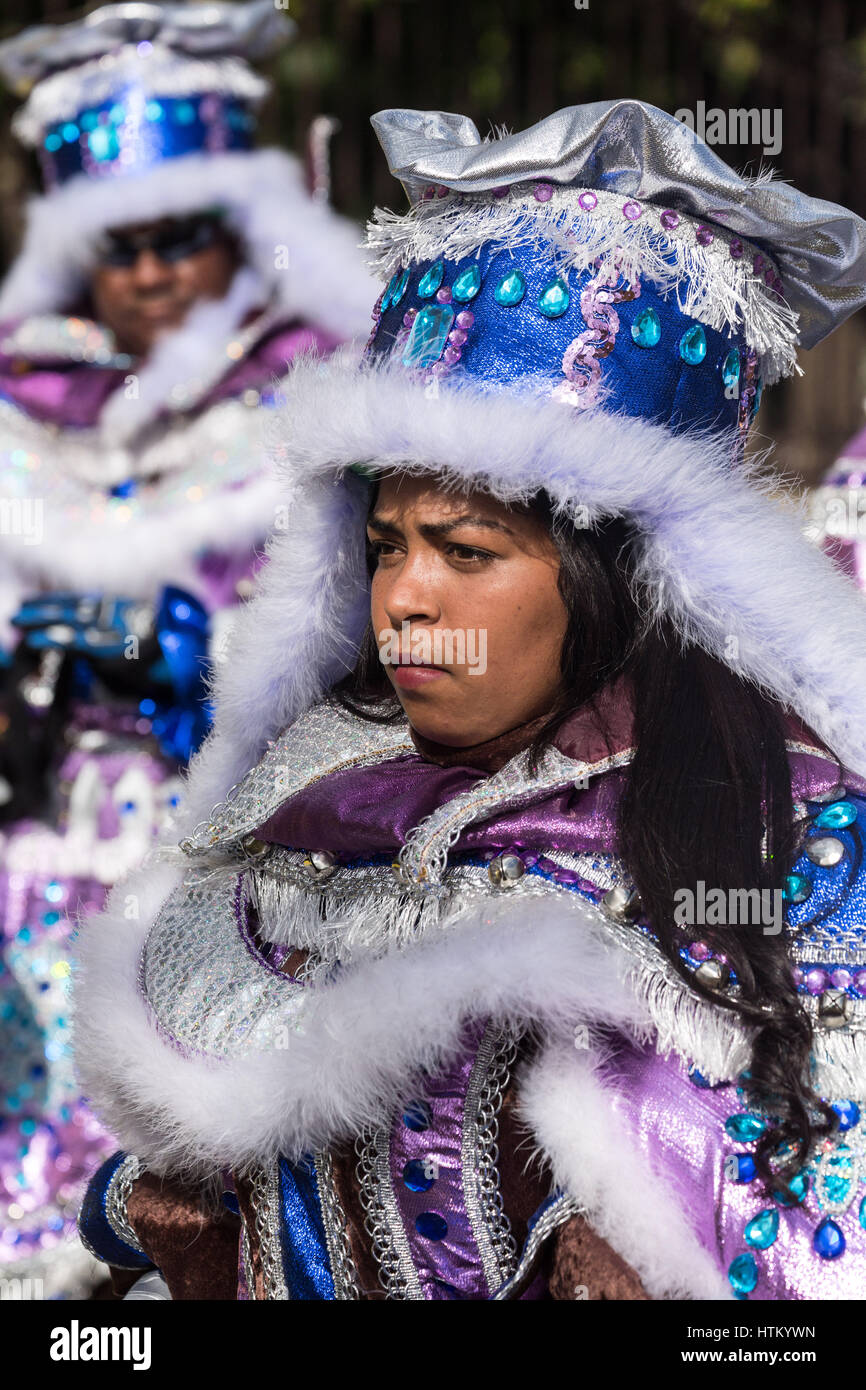 Woman in an elaborate costume marches in the La Vega Carnival parade ...