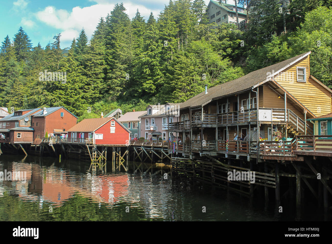 Susepnded houses on a small Alaskan river in Skagway ,Alaska Stock