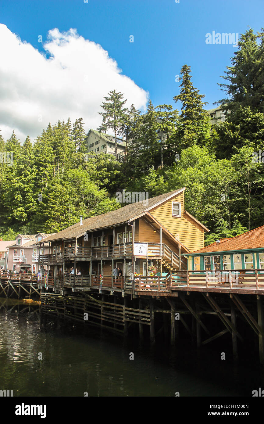 Susepnded houses on a small Alaskan river in Skagway ,Alaska Stock