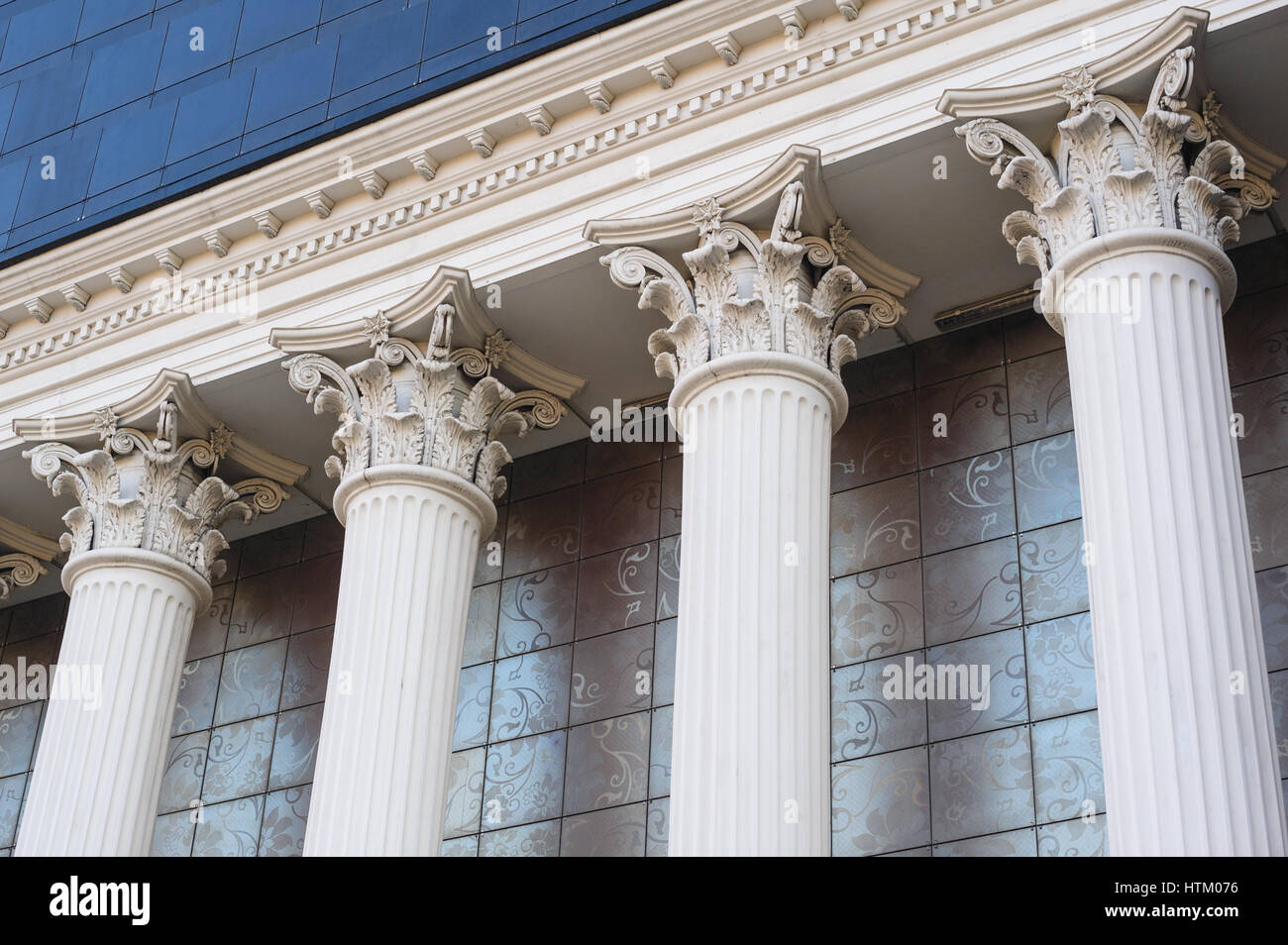 Architectural white Capital columns on the facade of the building. Stock Photo