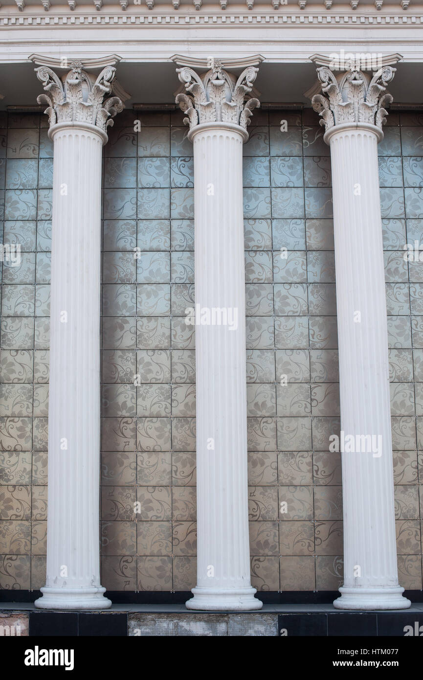 Architectural white columns on the facade of the building. Stock Photo