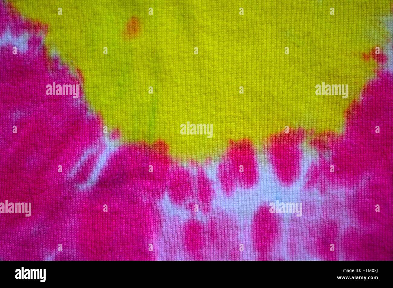 Tie dye patterns and swirls in pink and yellow Stock Photo Alamy