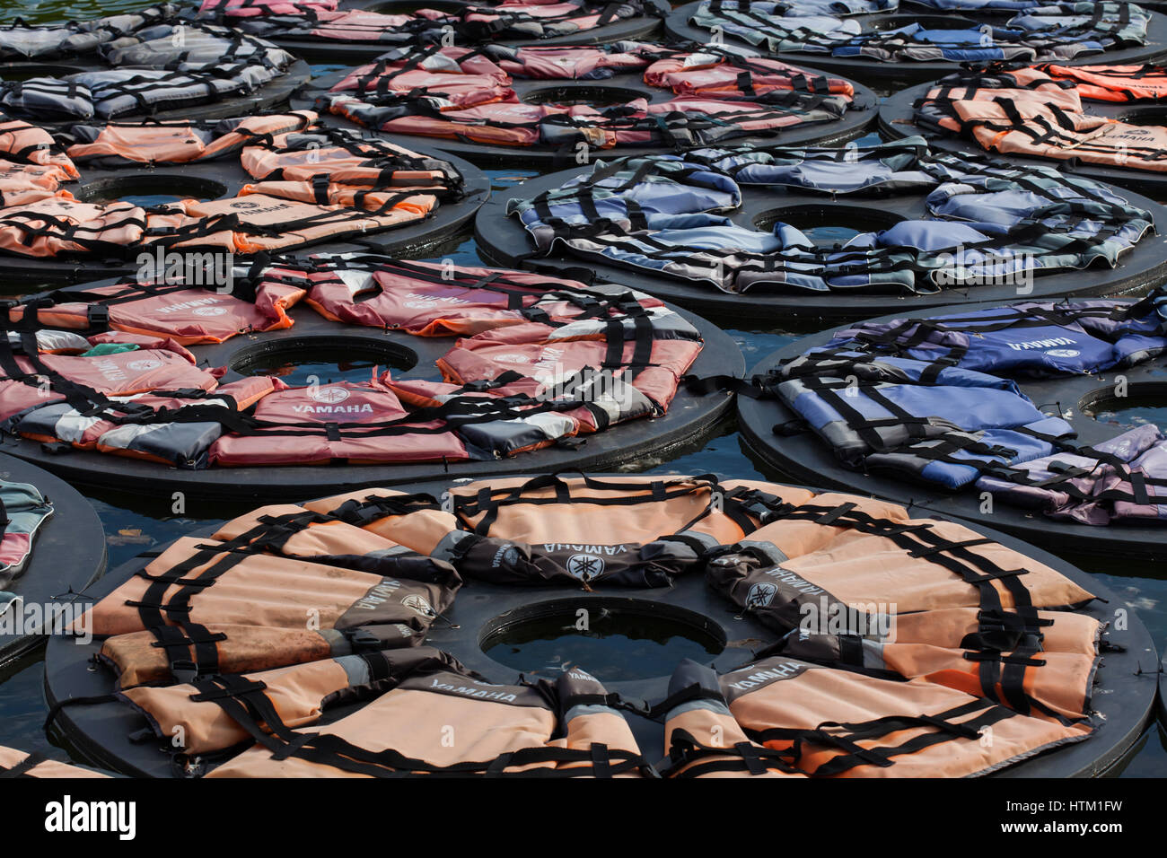 Floating installation of 1,005 life jackets in the shape of a lotus entitled F Lotus by Chinese contemporary artist Ai Weiwei (2016) on display in the Baroque pond in the Belvedere gardens in Vienna, Austria. Stock Photo