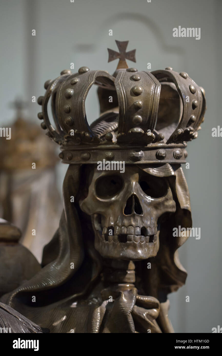 Skeleton crowned with the Royal Crown depicted on the sarcophagus of Holy Roman Emperor Charles VI (1685 - 1740) in the Kaisergruft (Imperial Crypt) in Vienna, Austria. Stock Photo