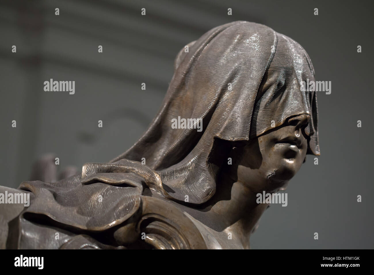 Mourning woman with veiled face depicted on the sarcophagus of the Empress Elisabeth Christine of Brunswick-Wolfenbuttel (1691 - 1750) in the Kaisergruft (Imperial Crypt) in Vienna, Austria. Empress Elisabeth Christine was a wife of Holy Roman Emperor Charles VI and a mother of Empress Maria Theresa. The statue is the earliest work by Austrian sculptor Balthasar Ferdinand Moll. Stock Photo