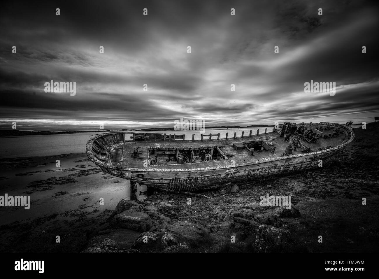 An old boat abandoned on Flatey Island in Iceland. Stock Photo