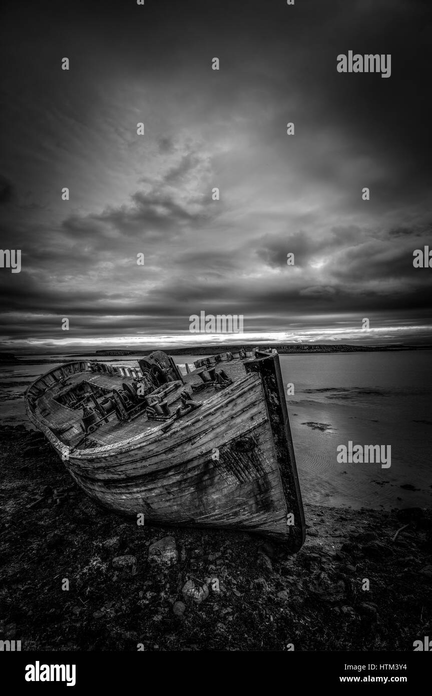 An old boat abandoned on Flatey Island in Iceland. Stock Photo