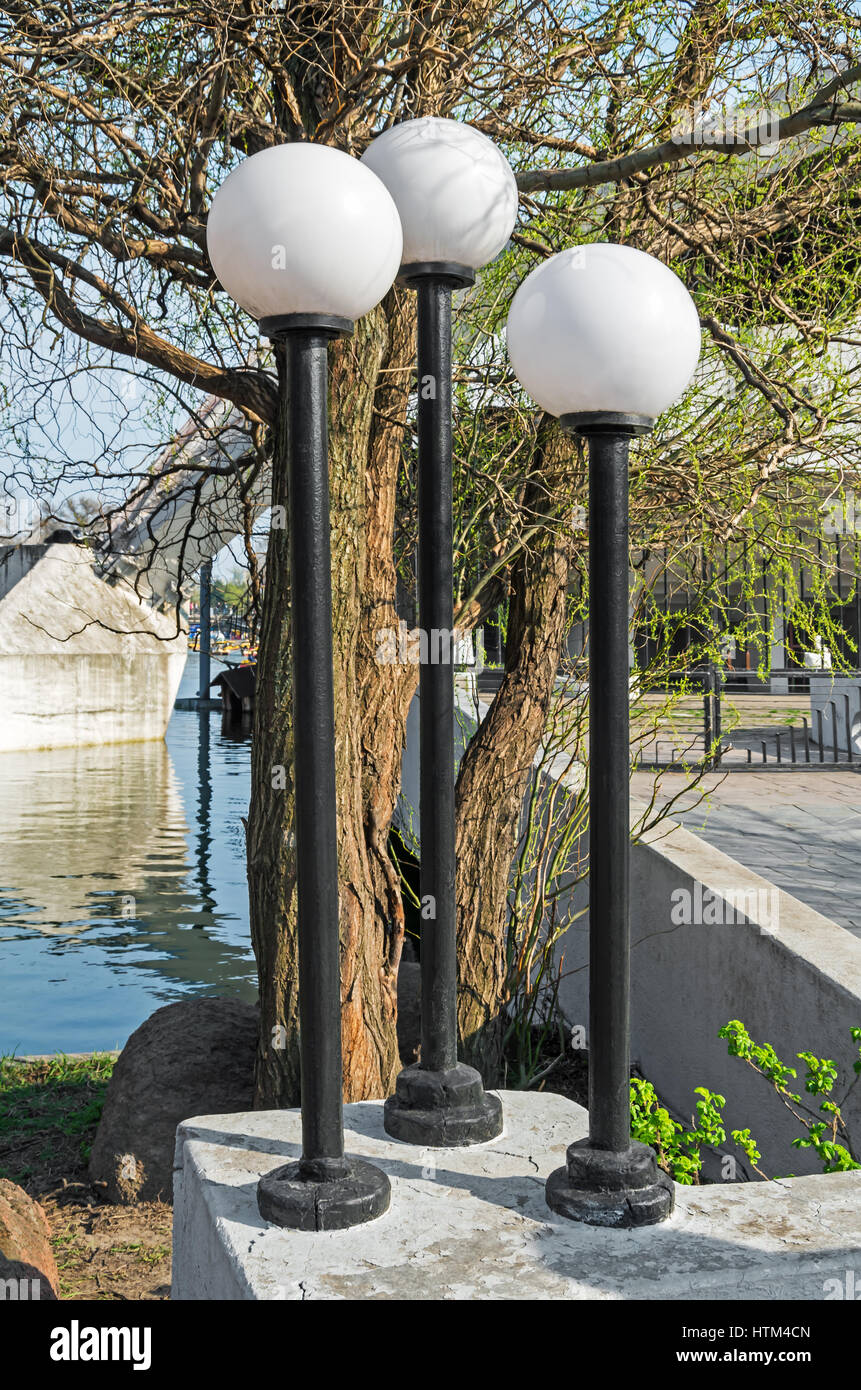 Round street lights in the Old Park in early spring Stock Photo