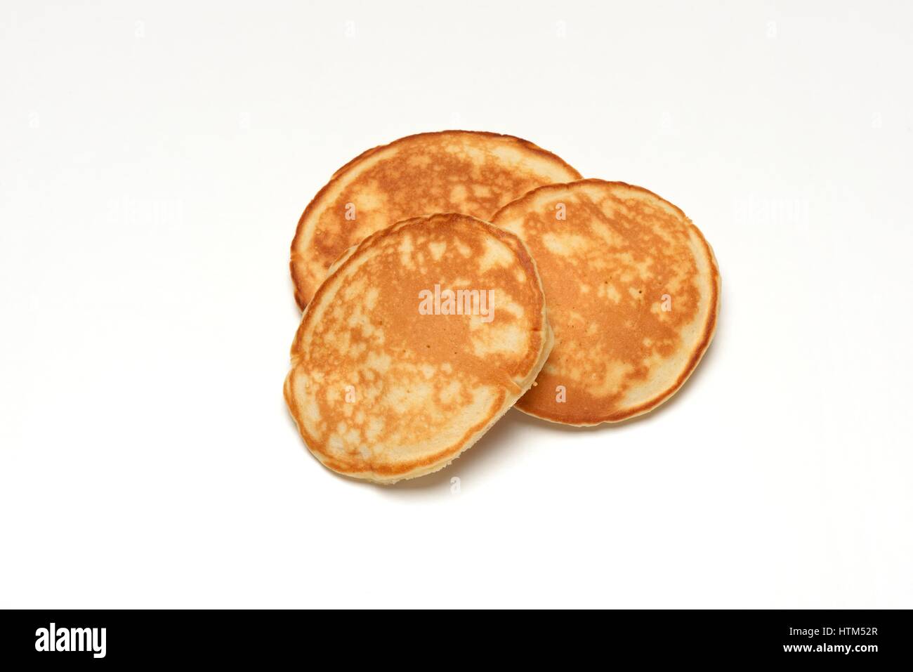 Three homemade Scottish pancakes isolated on a white background. Stock Photo