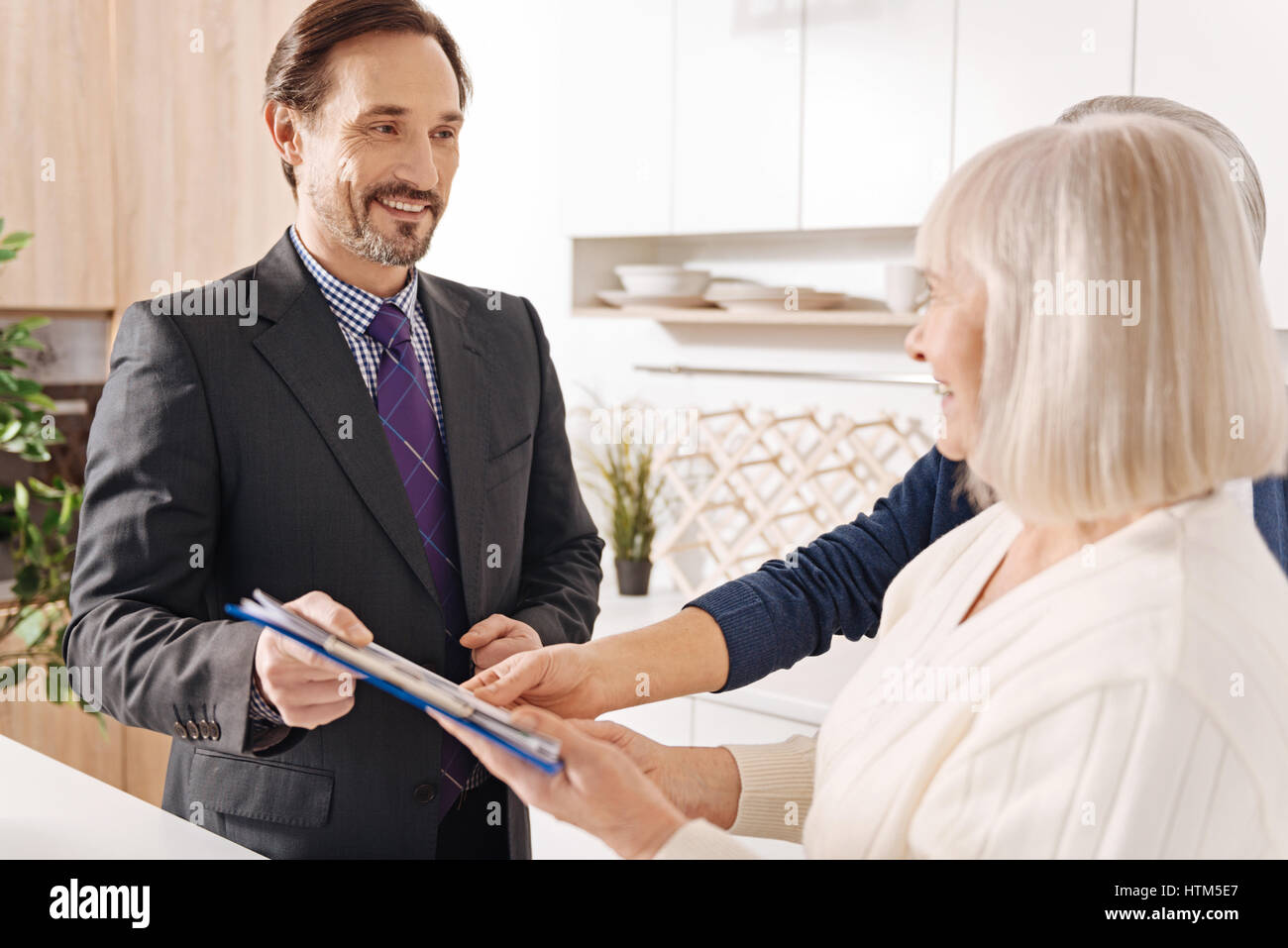 Experienced lawyer giving consultation to elderly couple about big purchase Stock Photo Alamy