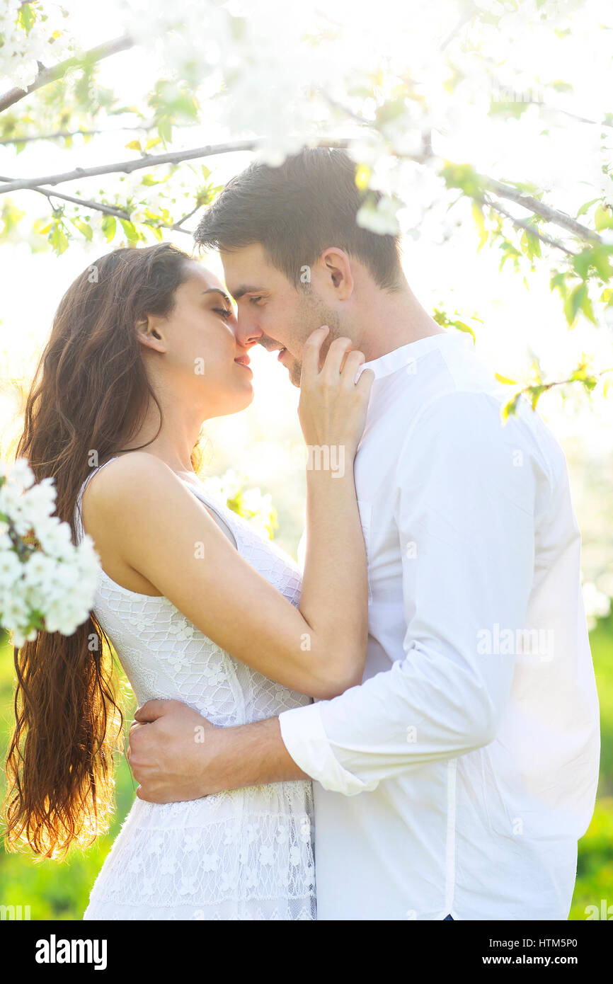 Young couple in love kissing and hugging in nature Stock Photo - Alamy