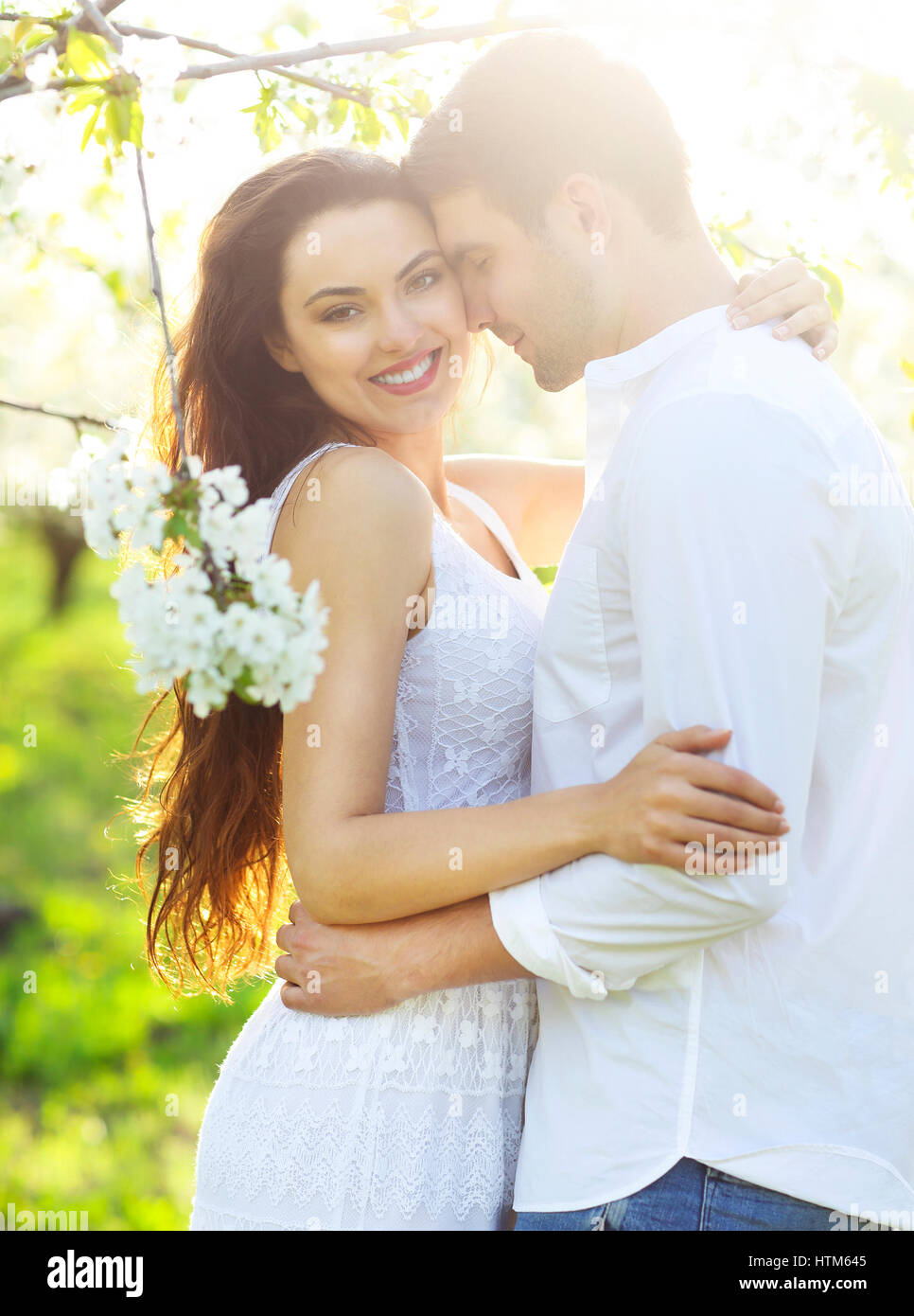 Young couple in love kissing and hugging in nature Stock Photo - Alamy