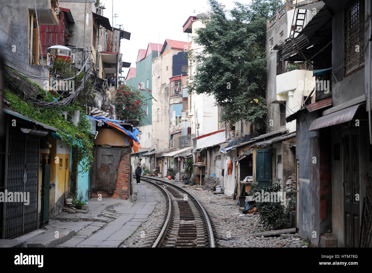 Houses and shops next to the railway tracks also known as the “Train