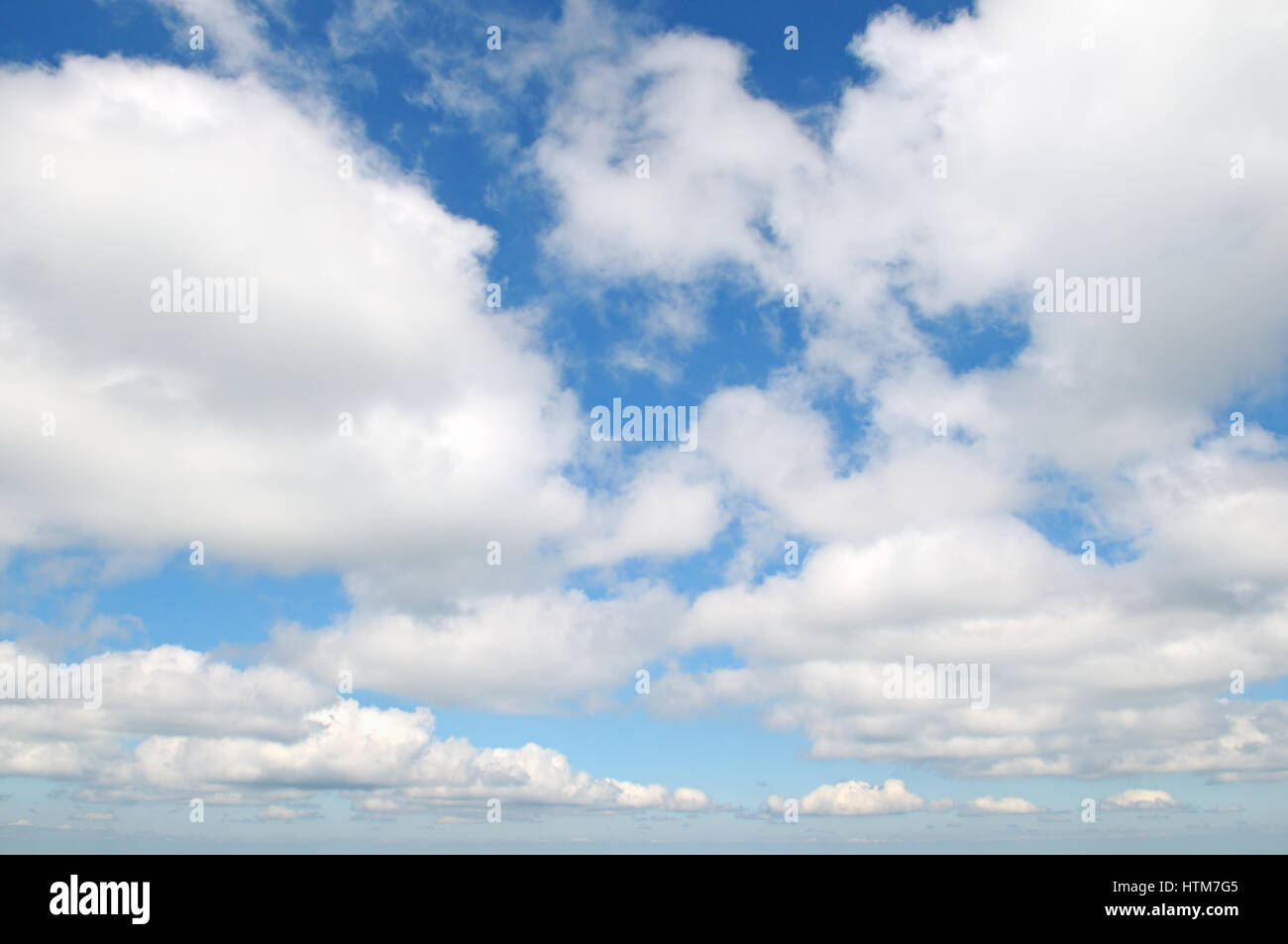 fluffy clouds in the blue sky Stock Photo - Alamy