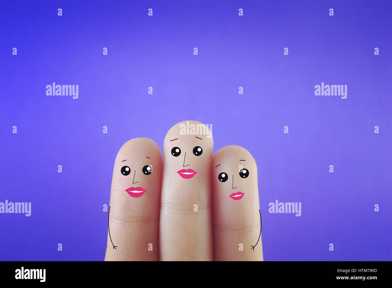 Three fingers decorated as three ladies who had plastic surgery. Suitable for anything about Plastic surgery. Stock Photo