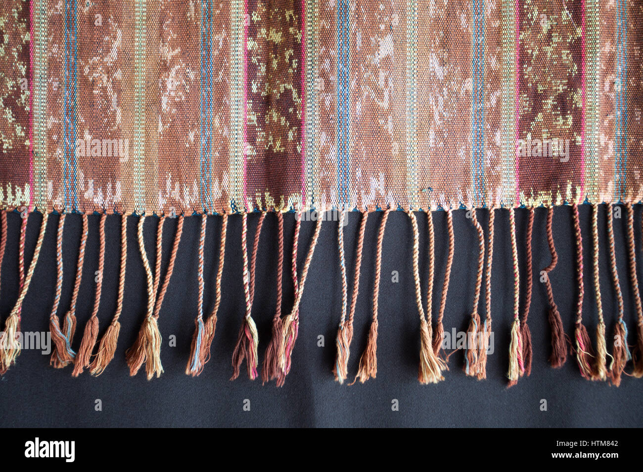Traditional Indonesian and Asian pattern on fabric with brushes closeup and details Stock Photo