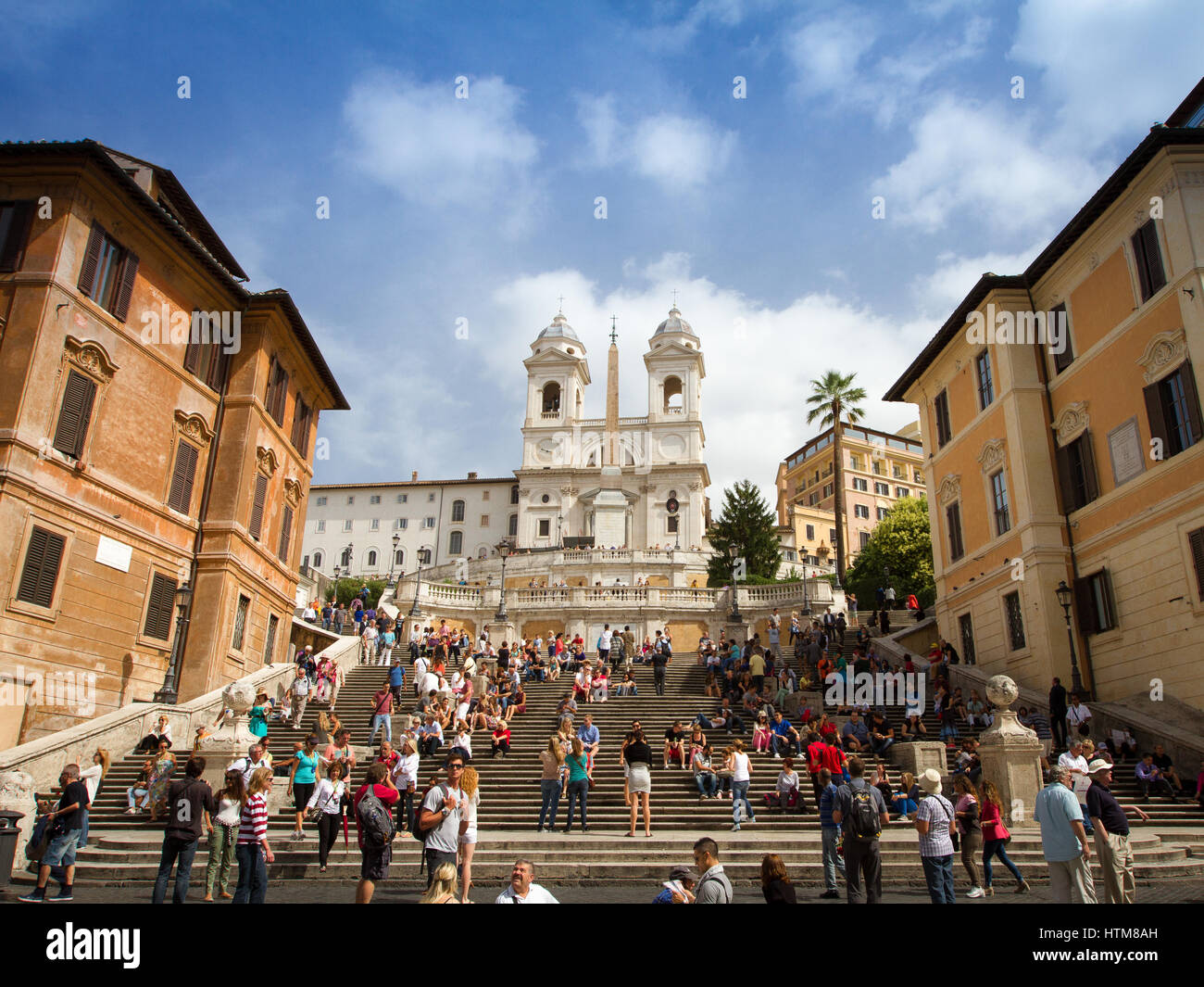 People climbing the Spanish Steps in Rome leading up to the Trinita dei ...