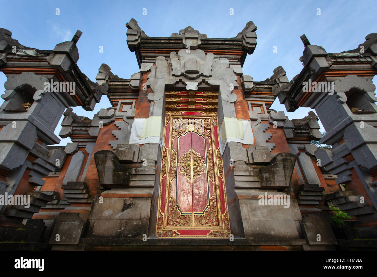Door with ornament in the Indonesian temple at sunrise, Bali Stock Photo