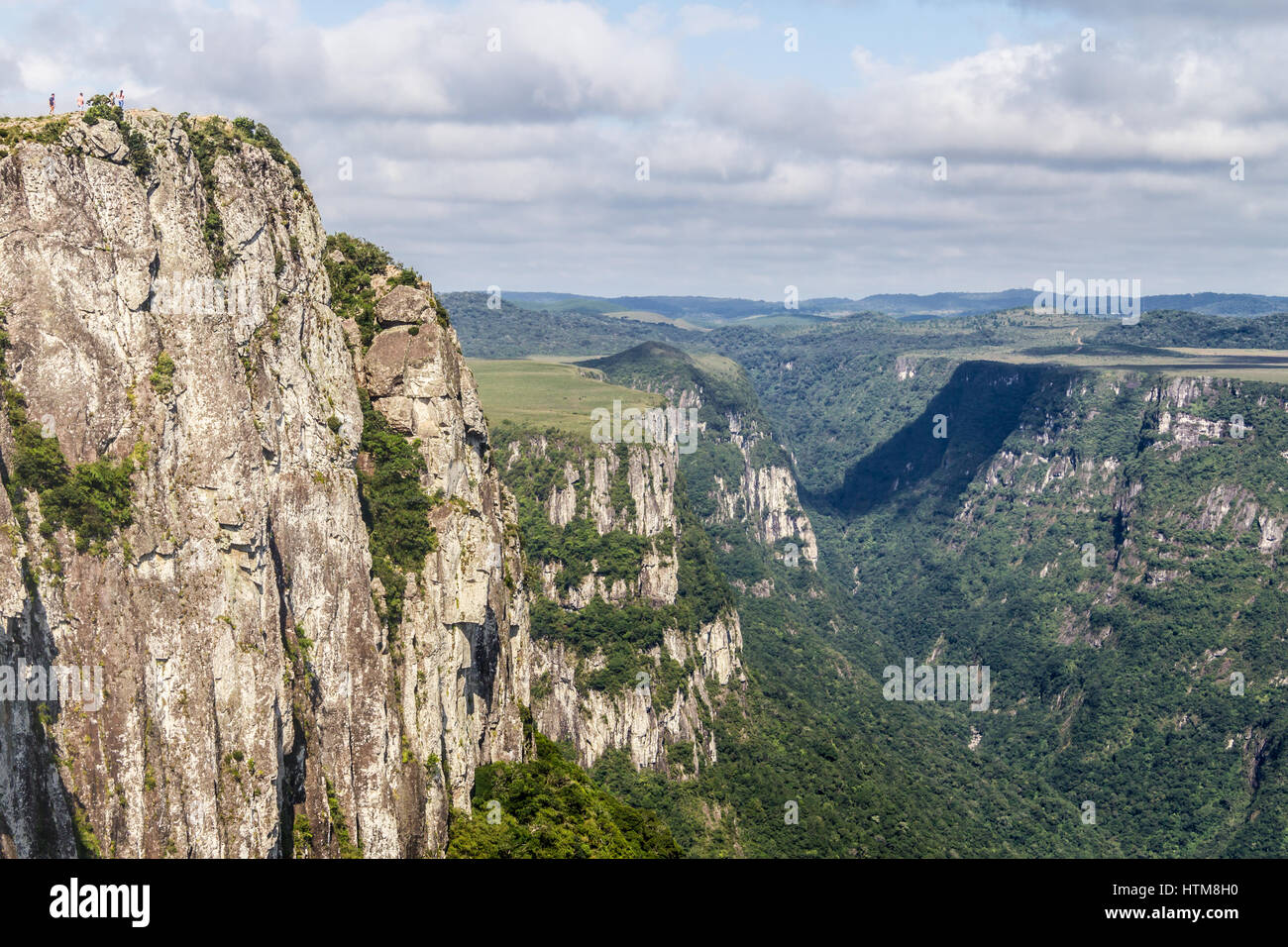 People over the Cliffs at Fortaleza Canyon, Cambara do Sul, Rio Grande do Sul, Brazil Stock Photo