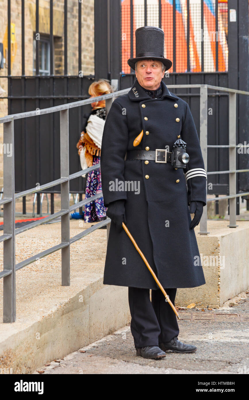 Man dressed in Victorian police uniform known as bobbies or