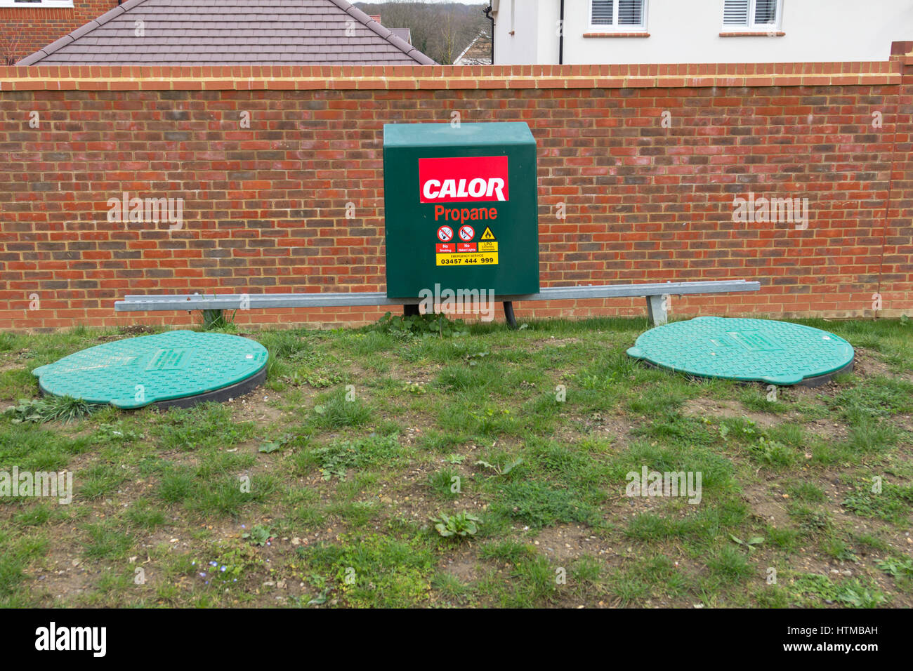 underground calor propane gas tanks and danger sign on a new housing estate, kent, uk Stock Photo