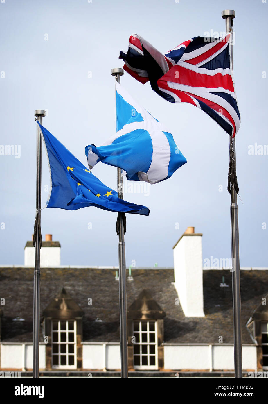 A Union Jack, Saltire and European flag fly outside the Scottish Parliament, Edinburgh. Stock Photo