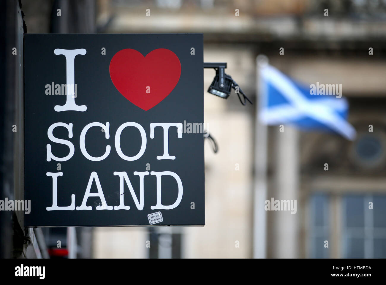 A general view of an 'I Love Scotland' sign and Saltire on the Royal Mile, Edinburgh. Stock Photo