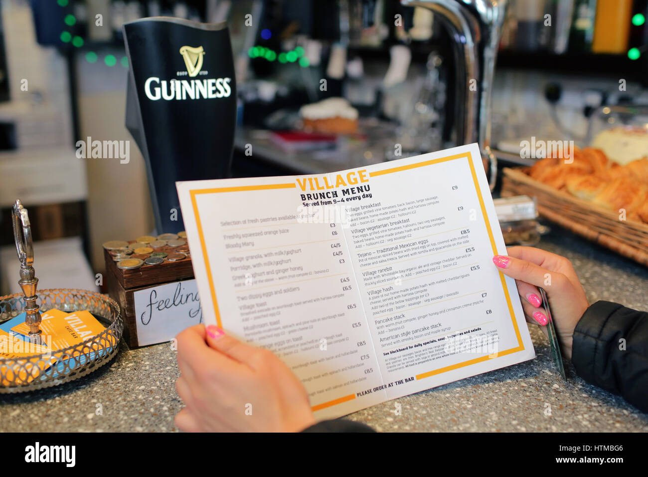 Lady orders food at a Bar Stock Photo Alamy