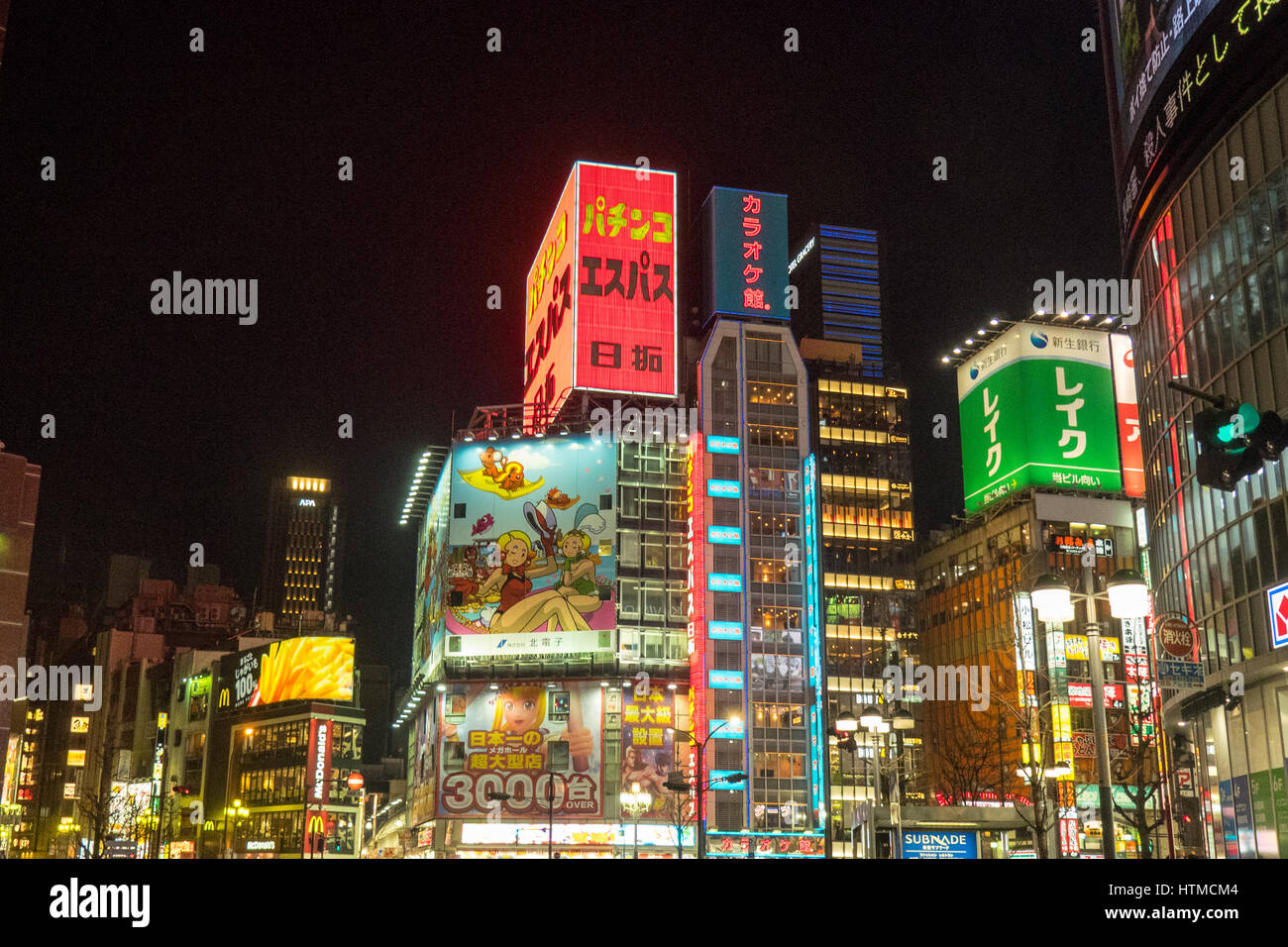 Bright colourful lights of commercial buildings at night in Shinjuku Tokyo Japan. Stock Photo