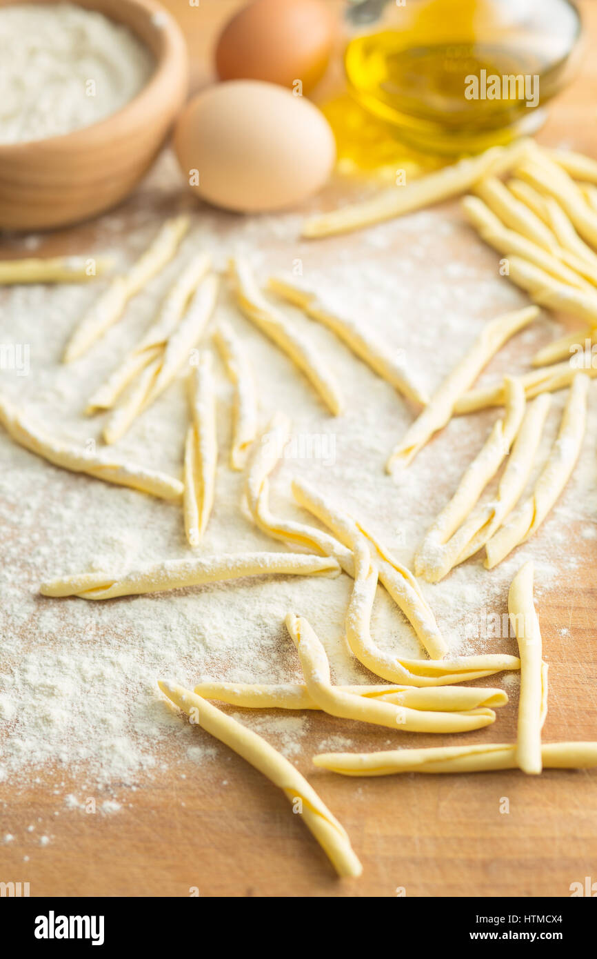 Raw italian pasta with flour Stock Photo Alamy