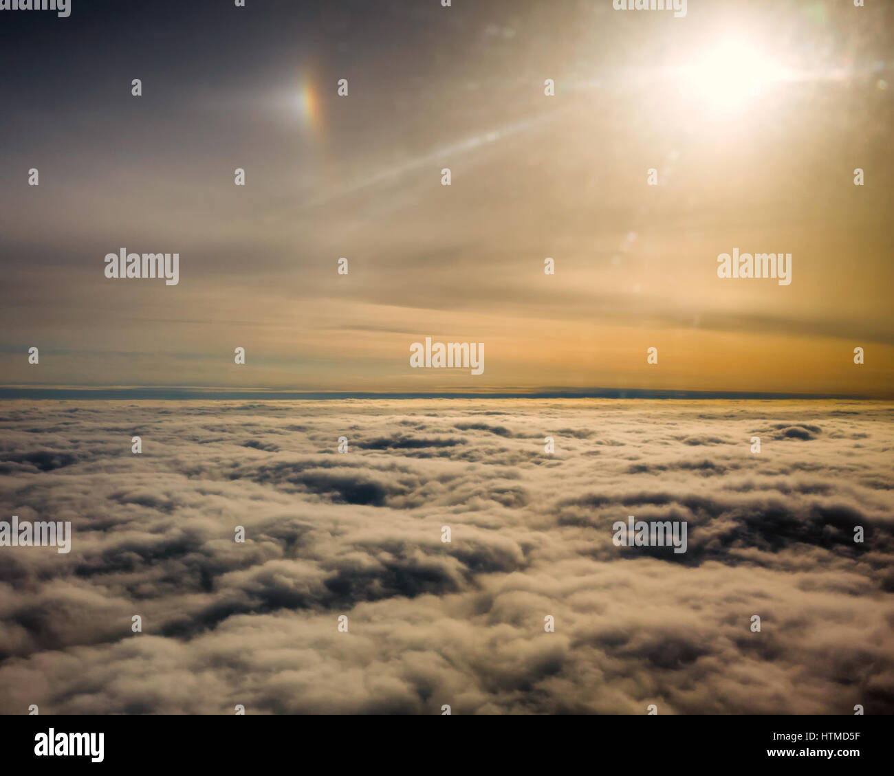 View of cloud formation and colourful skies flying above the clouds. Stock Photo