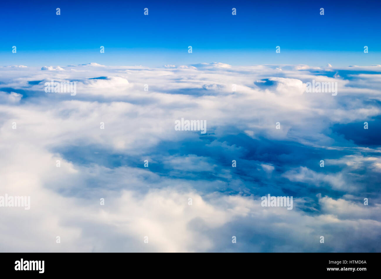 View of cloud formation and colourful skies flying above the clouds. Stock Photo