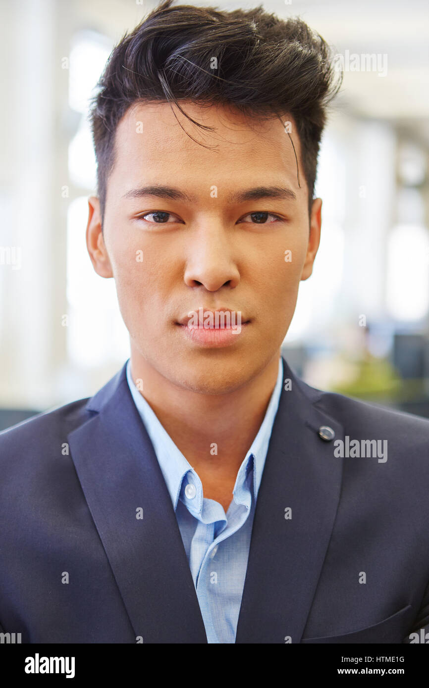 Asian man as businessman and consultant in office Stock Photo