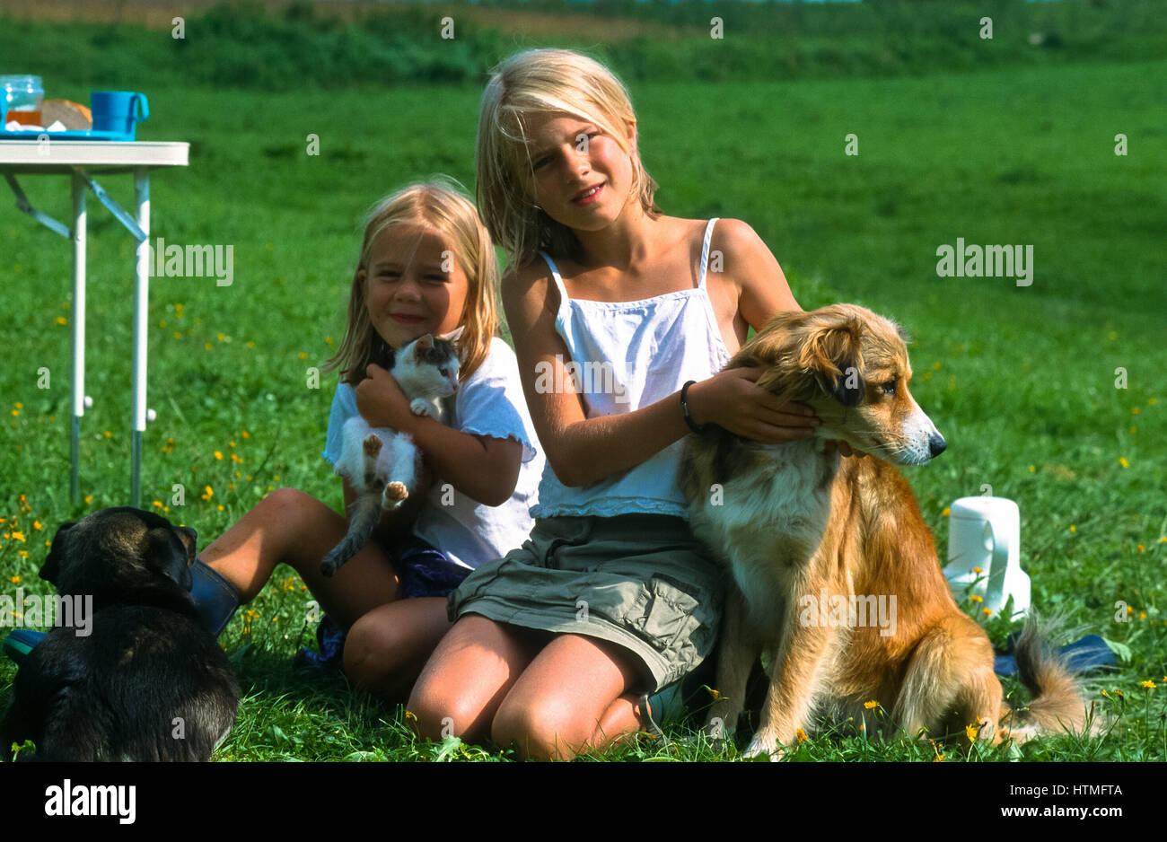 two girls with dogs at Poland Stock Photo - Alamy