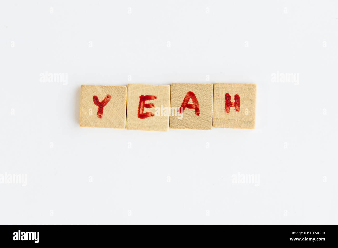 the word Yeah formed with letters written on squares of wood dowels
