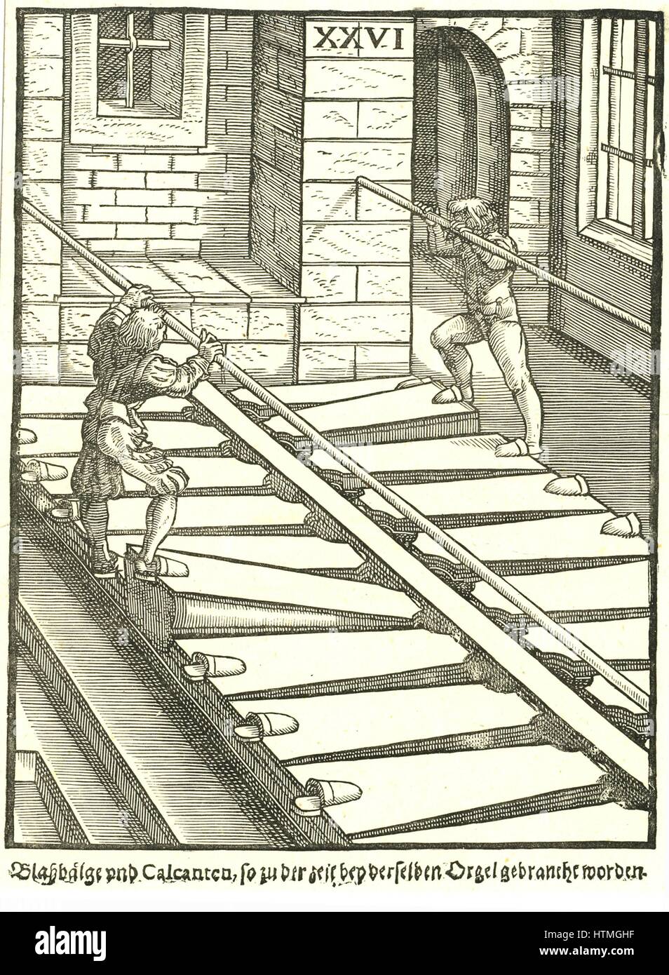 Bellows of a large organ, showing blowers working the bellows. Woodcut from Michael Praetorius 'Syntagma Musicum', 1615-1620. Stock Photo