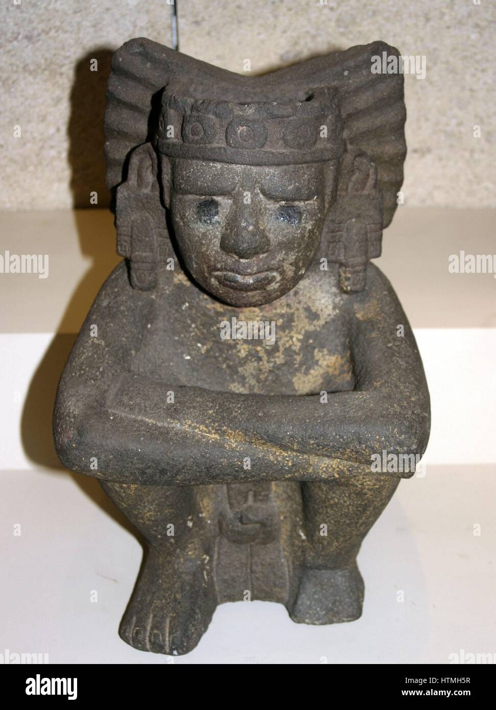 Seated stone figure of Xiuhtecuhtli - AD 1325-1521, Mexico Xiuhtecuhtli, was the Aztec god of fire Stock Photo