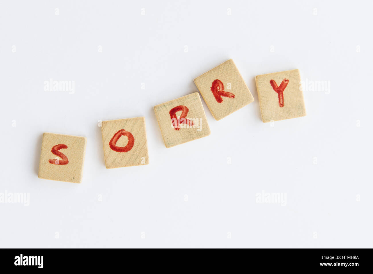 the word Sorry formed with letters written on squares of wood dowels Stock Photo