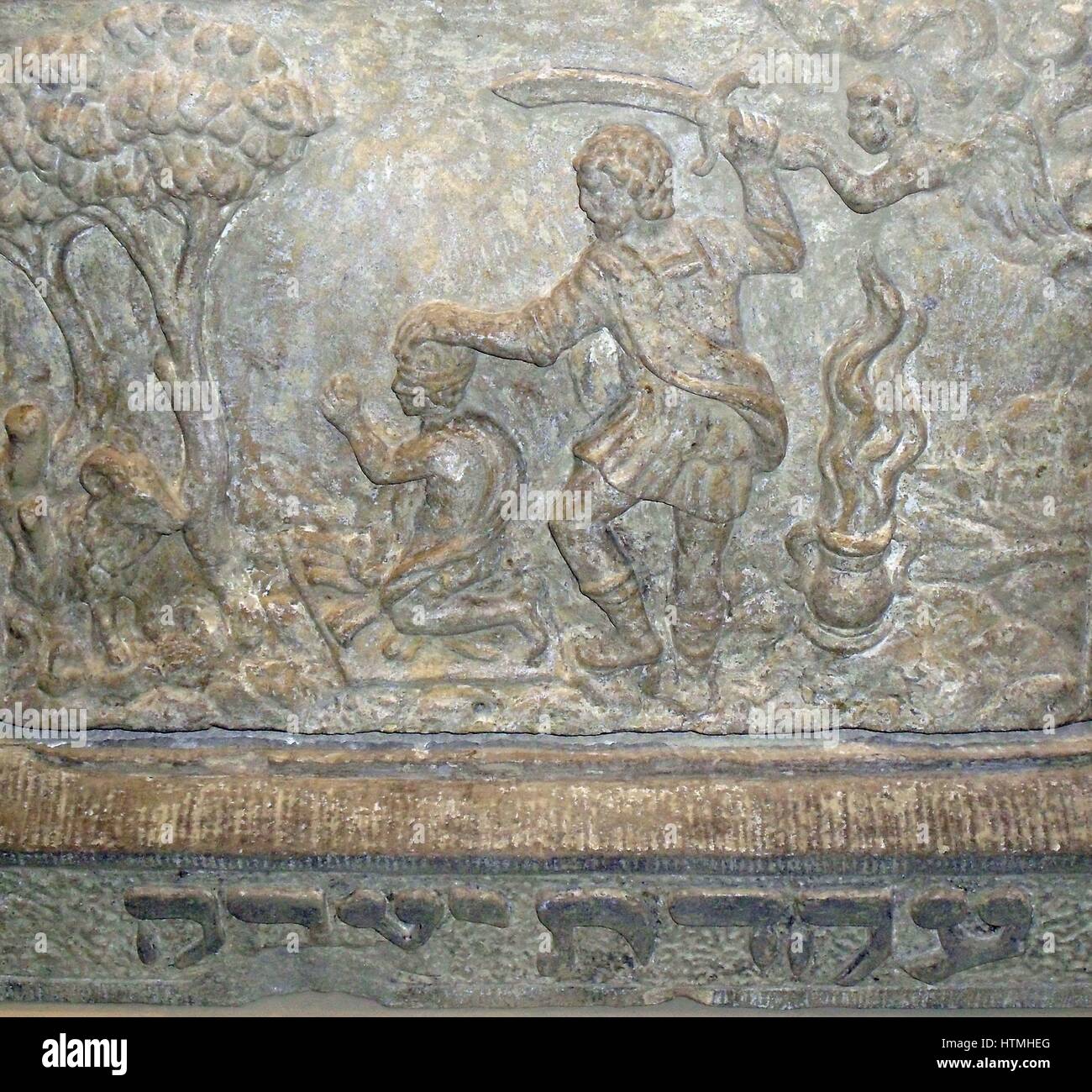 17th Century Dutch plaque from a house in Amsterdam depicting the Biblical account of Abraham preparing to sacrifice his son Isaac. Stock Photo