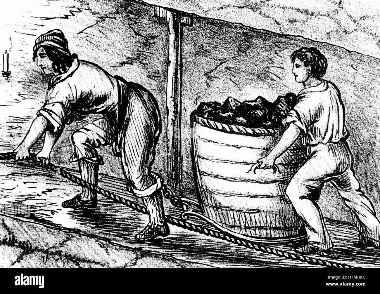 Woman and boy underground in coal mine drawing cart containing 3-4 cwt of coal - Bolton, Lancashire. From Matthias Dunn 'A Treatise on the Winning and Working of Collieries' Newcastle-upon-Tyne 1848 Stock Photo