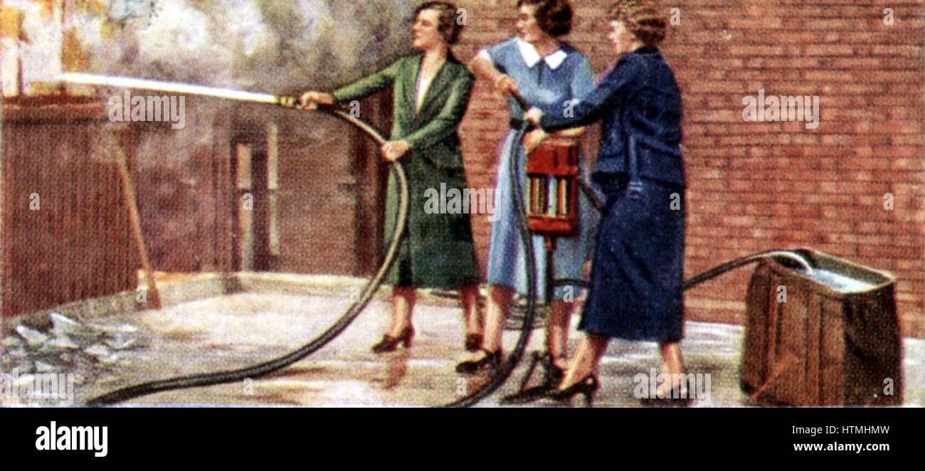 'Air Raid Precautions': Set of 50 cards issued by WD & H0 Wills, Britain 1938, in preparation for the anticipated coming of World War II. Women fire-fighting with two-person manual fire pump Stock Photo