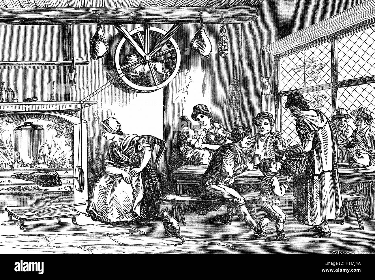 Turnspit dog at work in the inn at Newcastle, Carmarthen, Wales, c1800. These short-legged dogs were bred especially to work in wheels turning cooking spits. By 1800 the breed had almost disappeared. Wood engraving 1869. Stock Photo