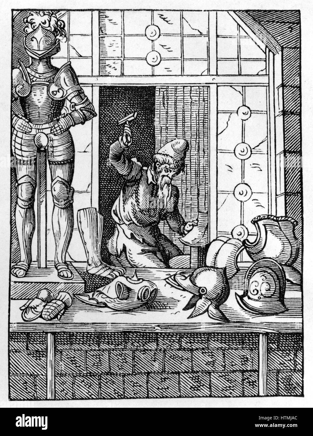 The Armourer. Armourer in his workshop is using hammer to shape a piece of armour. On display in front of his shop are items he has made, including a full suit of armour. Woodcut by Jost Amman (1535-1591) Swiss engraver. Stock Photo