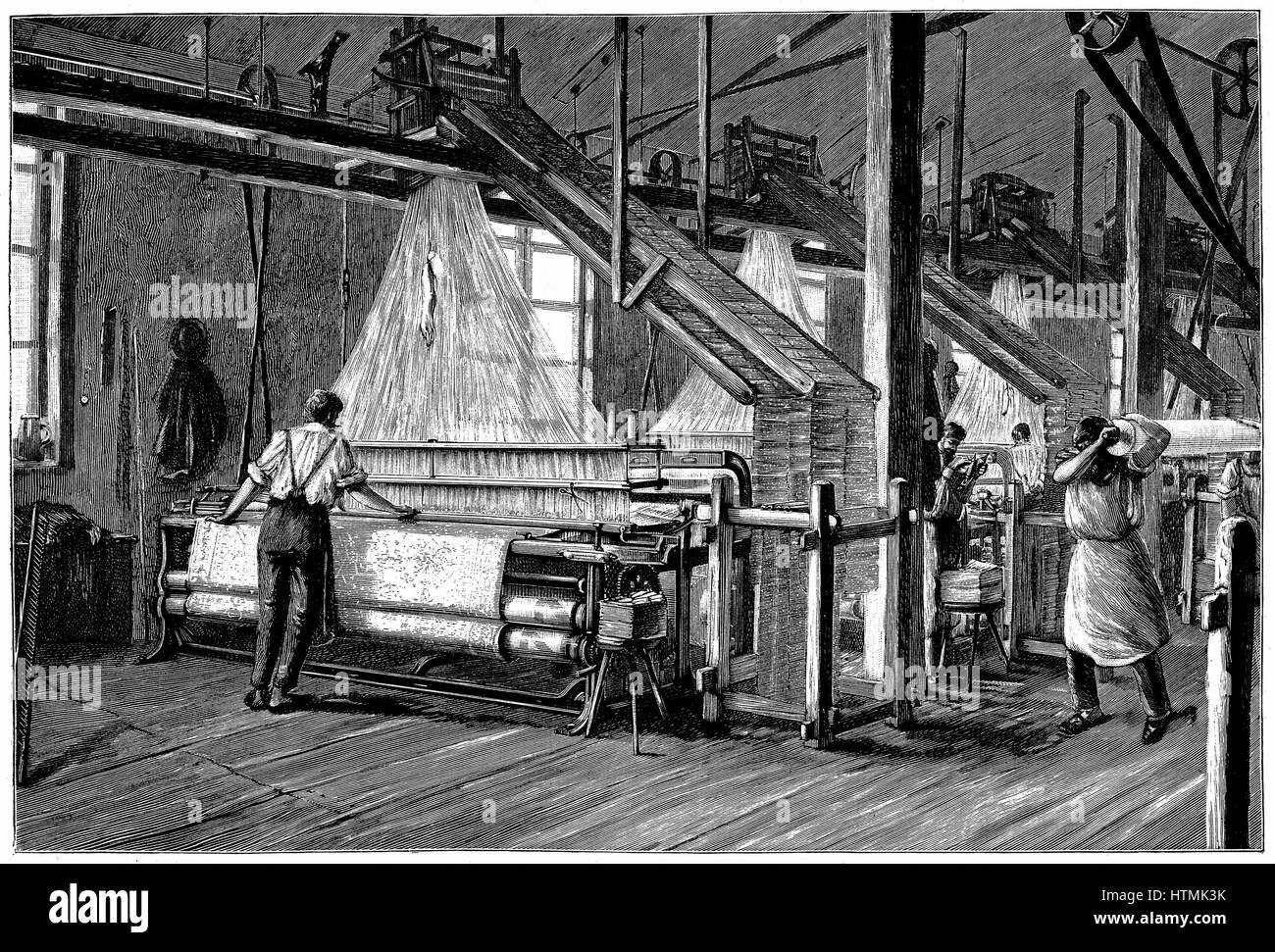 Weaving shed fitted with Jacquard power looms. Swags of punched cards carrying pattern being woven are at right and above each loom. Illustration Paris c1880 Stock Photo