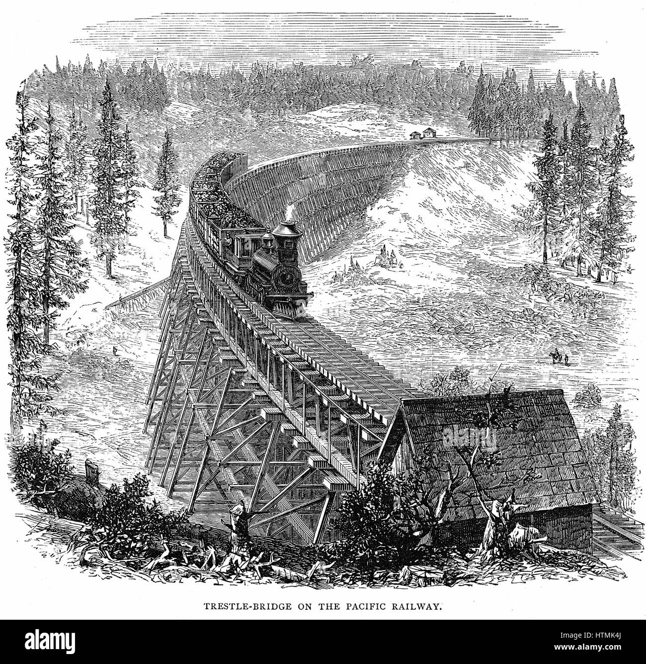 Union Pacific Railroad: Train crossing wooden trestle bridge carrying ...