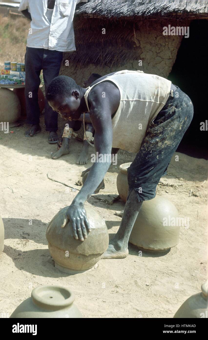 Making pots without a wheel. Nigeria c1966. Portrait format Stock Photo