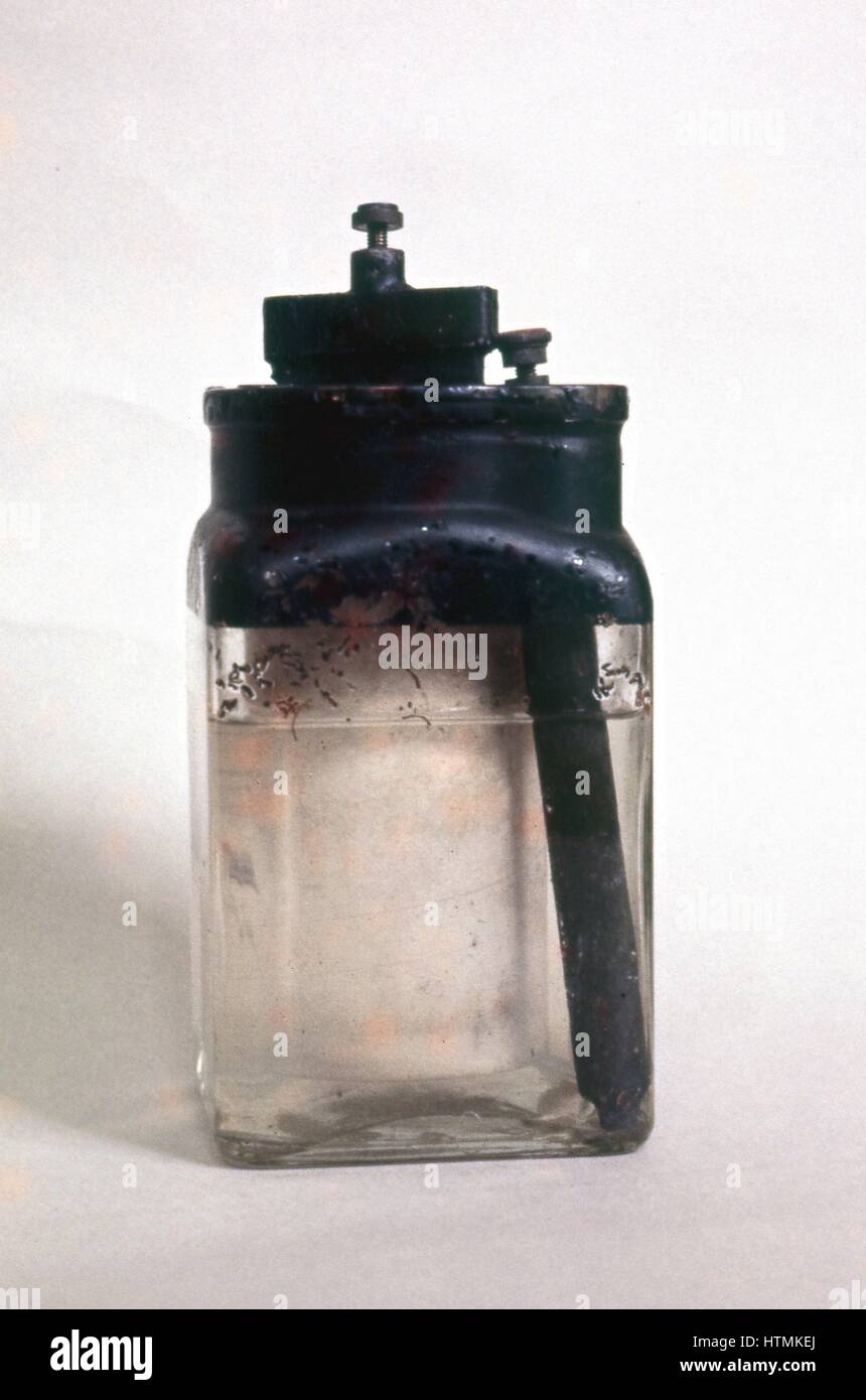 Wet Battery: Leclance cell, invented c1866. Glass vessel containing zinc rod, solution of chloride of ammonia, and porous block of carbon surrounded by pieces of carbon manganese dioxide and sealed with pitch. Stock Photo